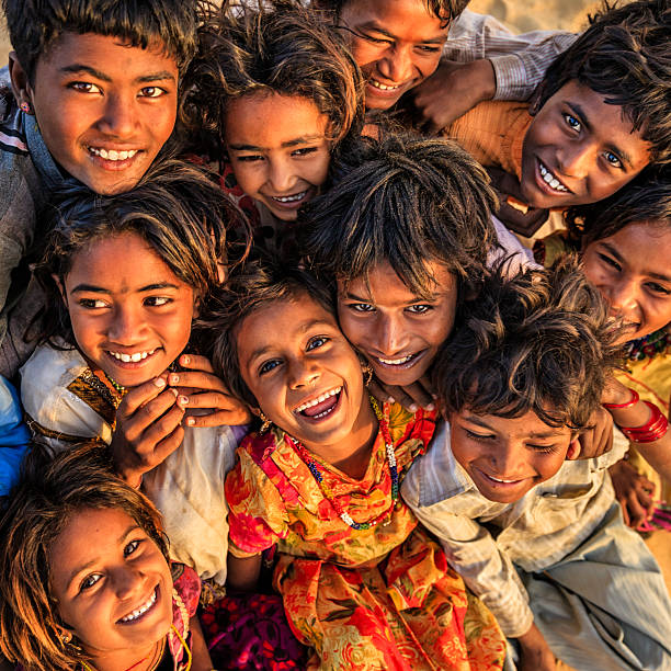 Group of happy Gypsy Indian children - desert village, Thar Desert, Rajasthan, India.